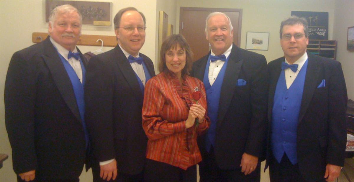 Sheila Walk poses with a quartet from the Land of Lincoln Barbershop Chorus