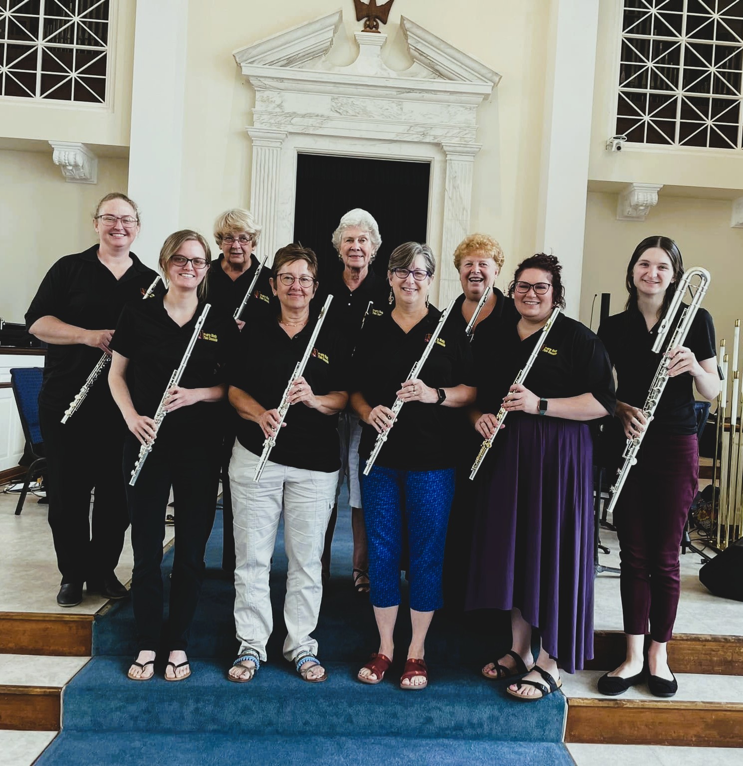 group of people posing with instruments