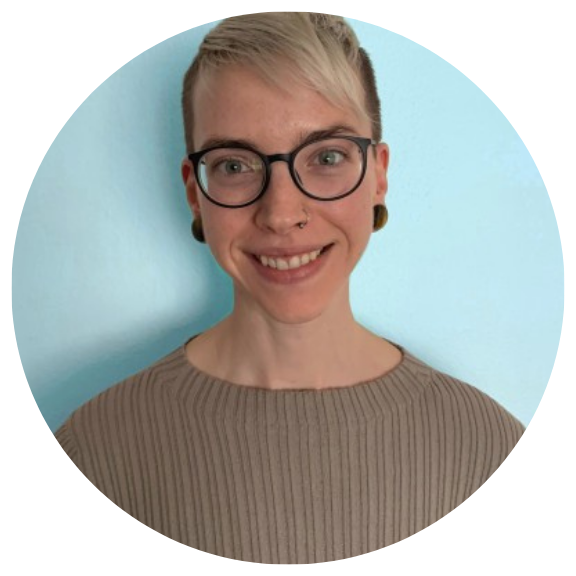 Headshot of a white woman smiling at camera
